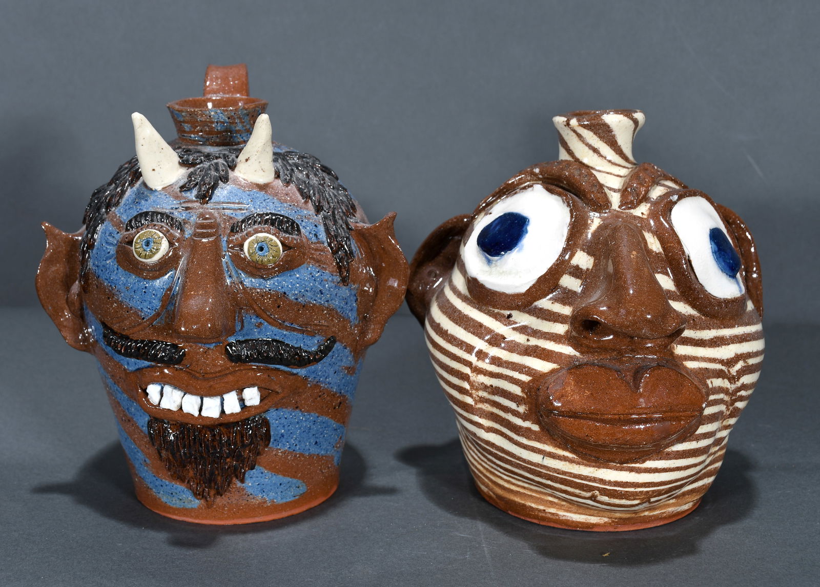 Albert Hodge. Pair of Face Jugs Big Eyes and Devil. (1 of 3)