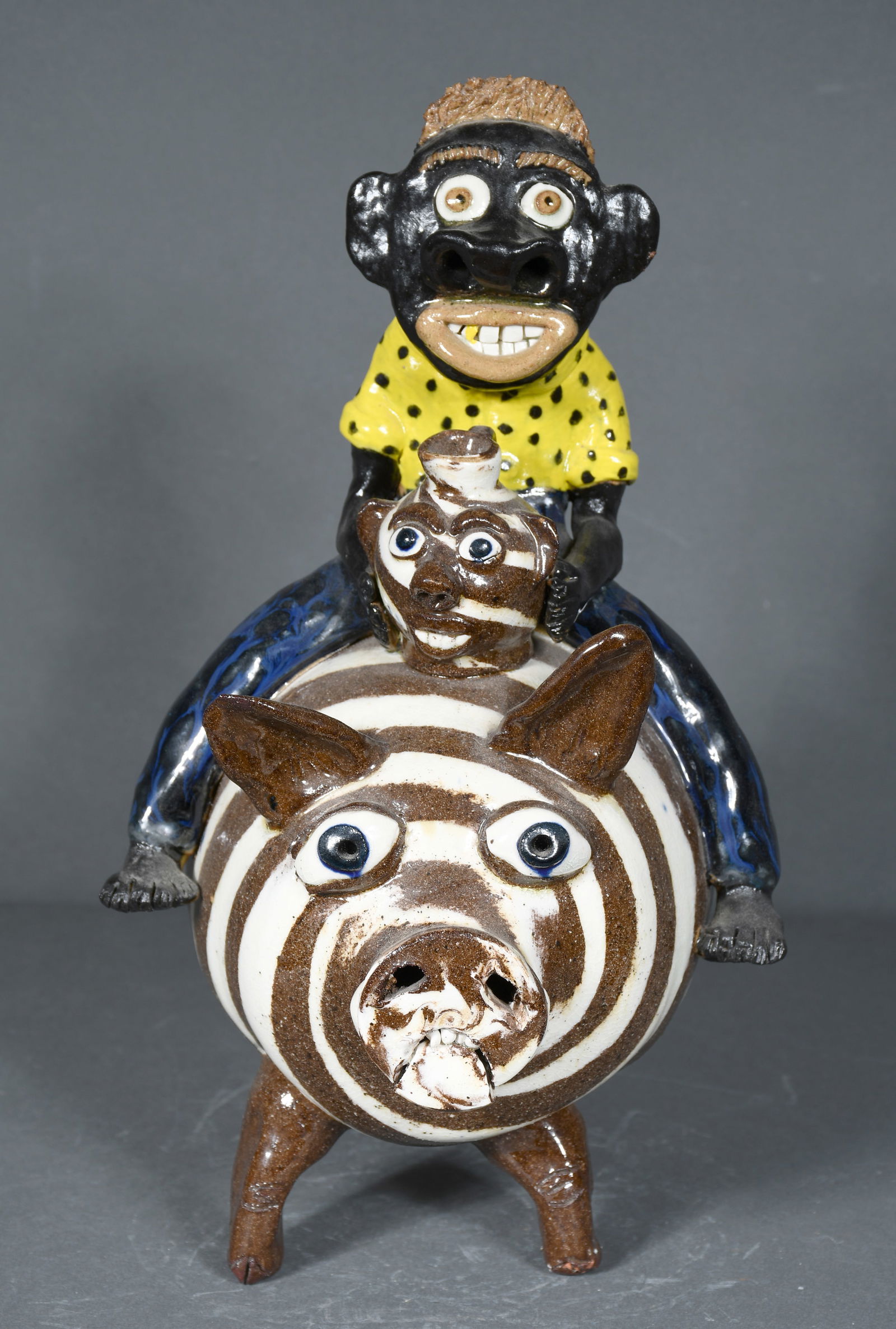 Albert Hodge.  Man Riding Swirl Pig. (1 of 3)