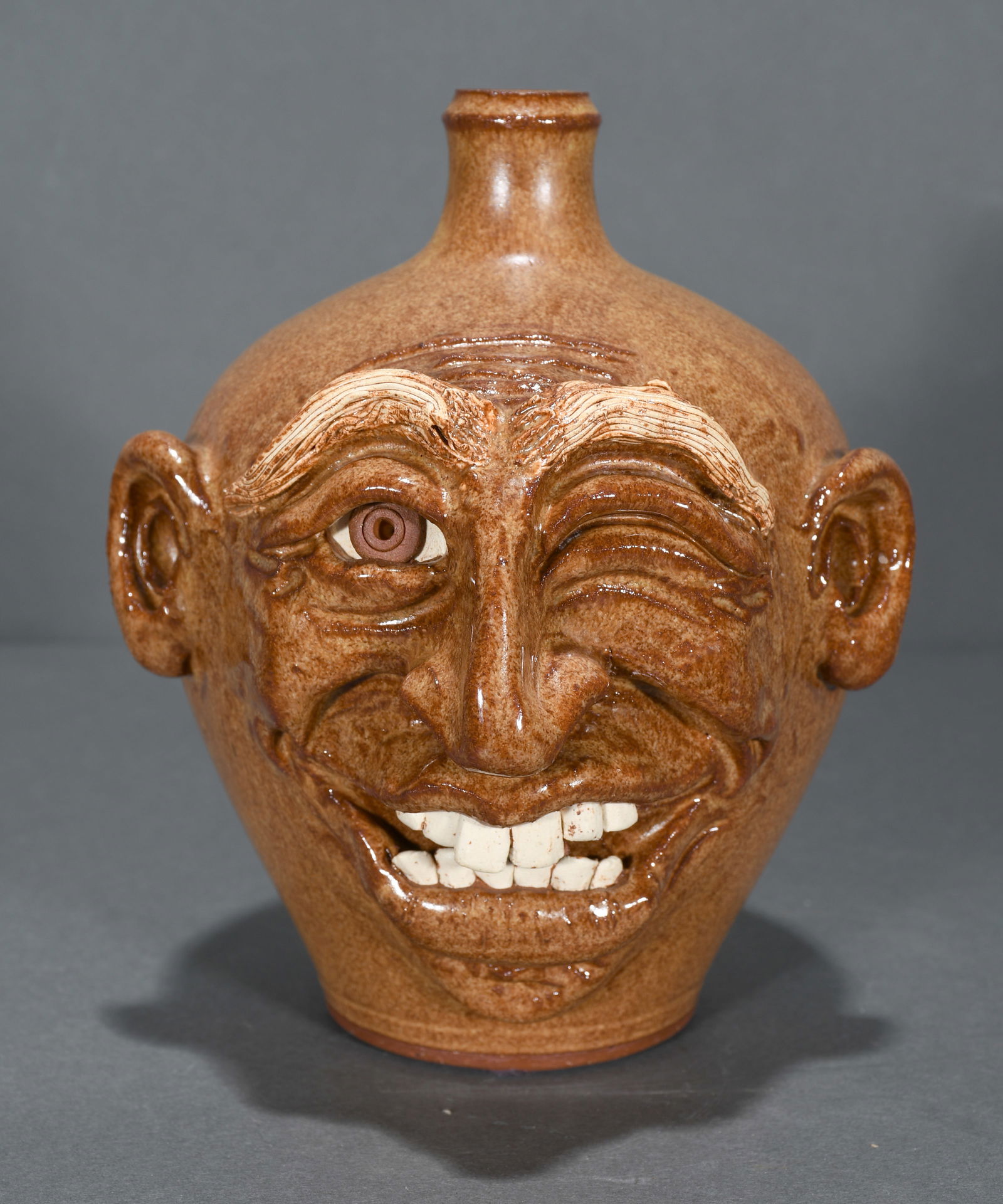 Sandy Cole.  Winking Eye Face Jug. (1 of 3)