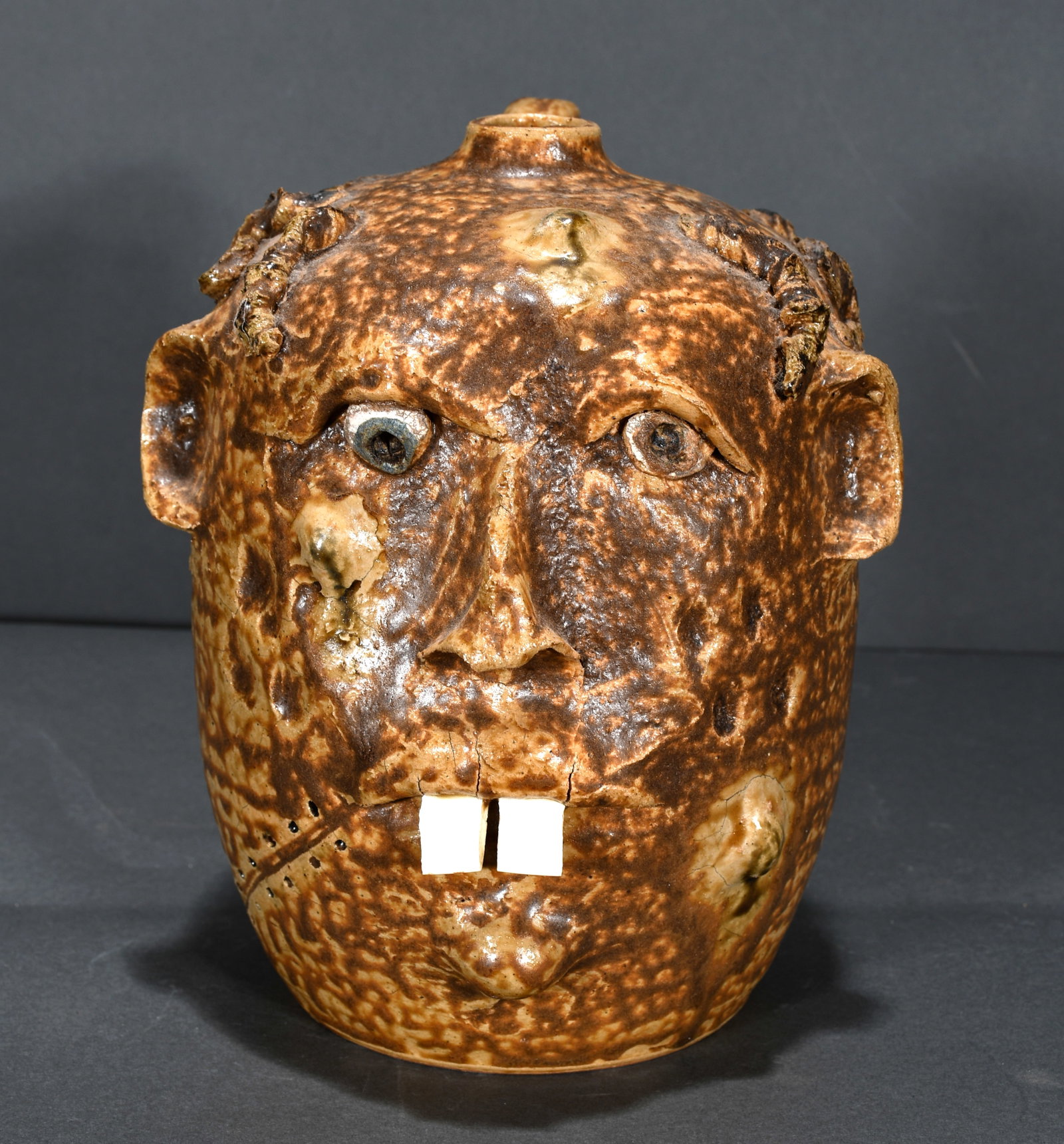 Turkey Mountain Pottery. Buck Tooth Faced Jug.: Turkey Mountain Pottery. Buck Tooth Faced Jug. 2004. Signed and dated. Mint condition. 9" h. Est. $100-200. Ship: $45