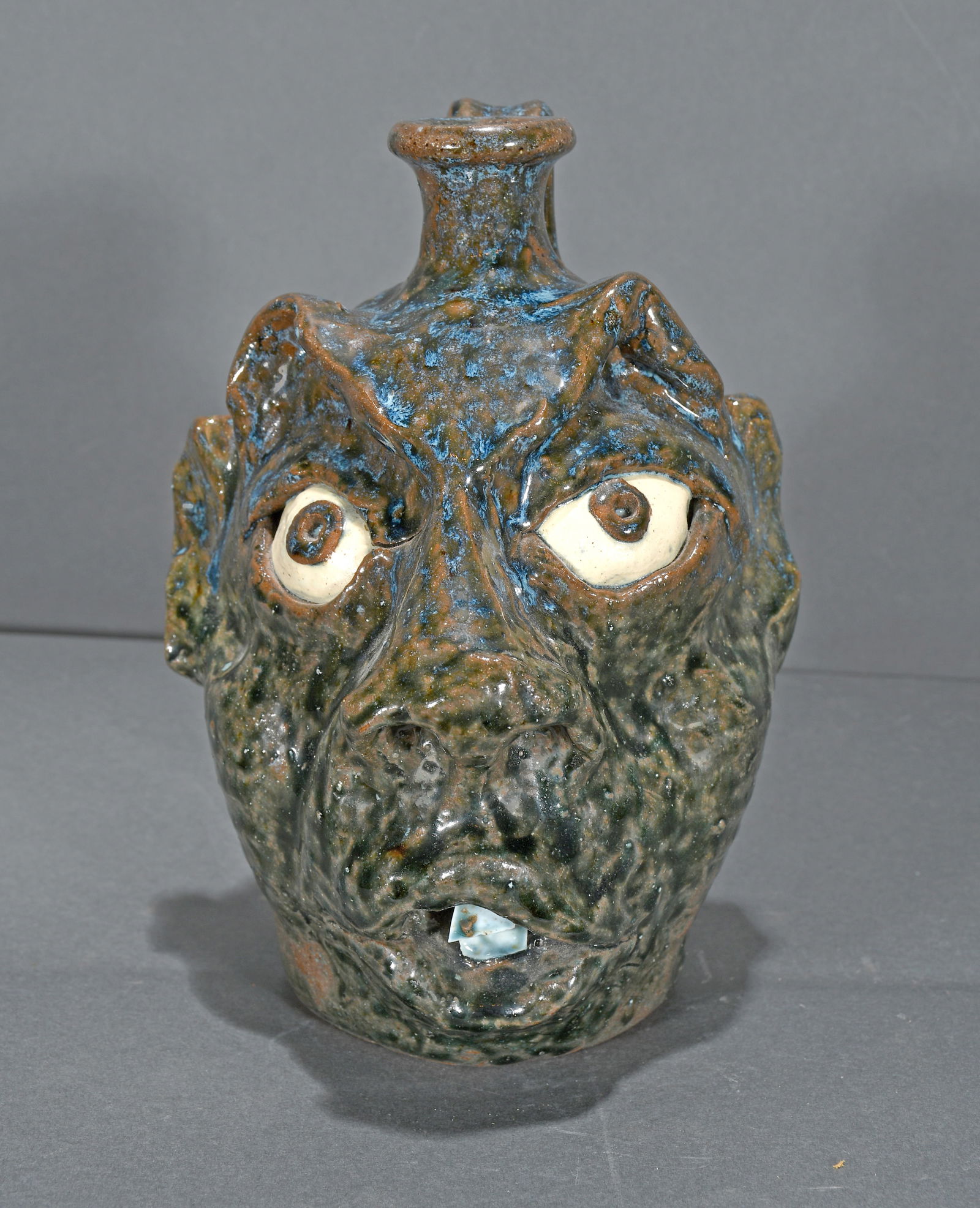 W.A. Flowers.  Snaggletooth Face Jug. (1 of 2)