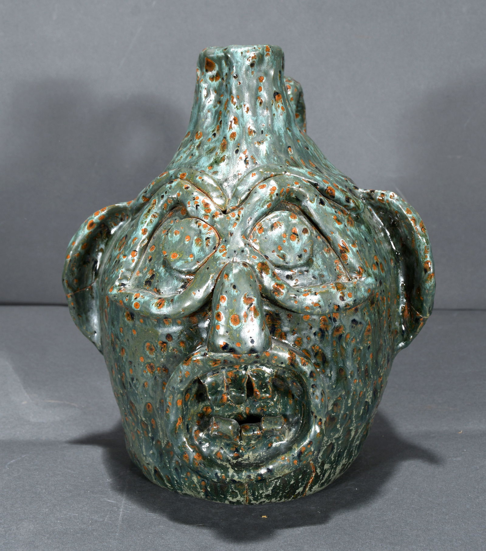 CH Potteries.  Heavily Glazed Primitive Face Jug. (1 of 3)