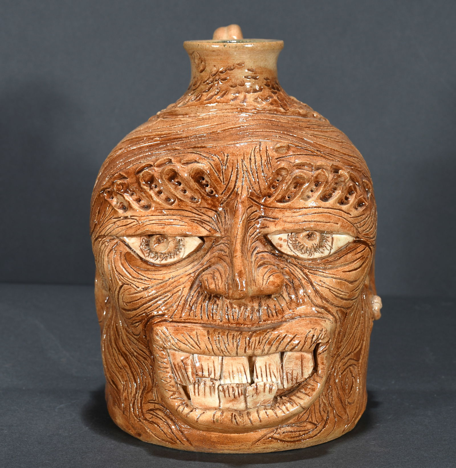 Eugene and Rosa Winton.  Heavily Decorated Face Jug. (1 of 3)