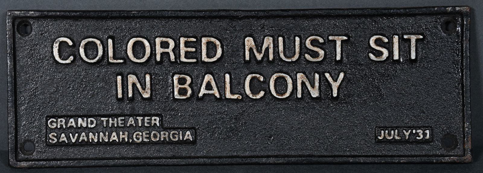 Segregation Sign. Colored Must Sit In Balcony Grand Theatre Savannah, Georgia.: Segregation Sign. Colored Must Sit In Balcony Grand Theatre Savannah, Georgia. 1931. Paint on wrought iron. Excellent condition. 8" w x 3" h. Provenance: The Richard Harris African American Experience