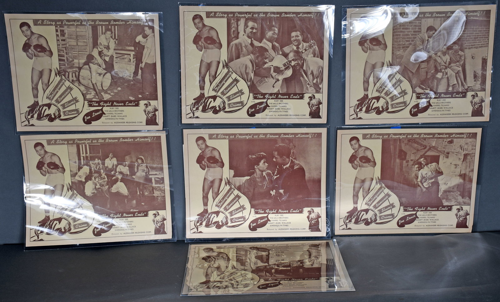 Set of Original-Release Lobby Cards for Joe Louis's Second Film The Fight Never Ends.: Set of Original-Release Lobby Cards for Joe Louis's Second Film The Fight Never Ends. c. 1949. In The Fight Never Ends, "The Brown Bomber" plays himself, and becomes a role model for a group of Harlem