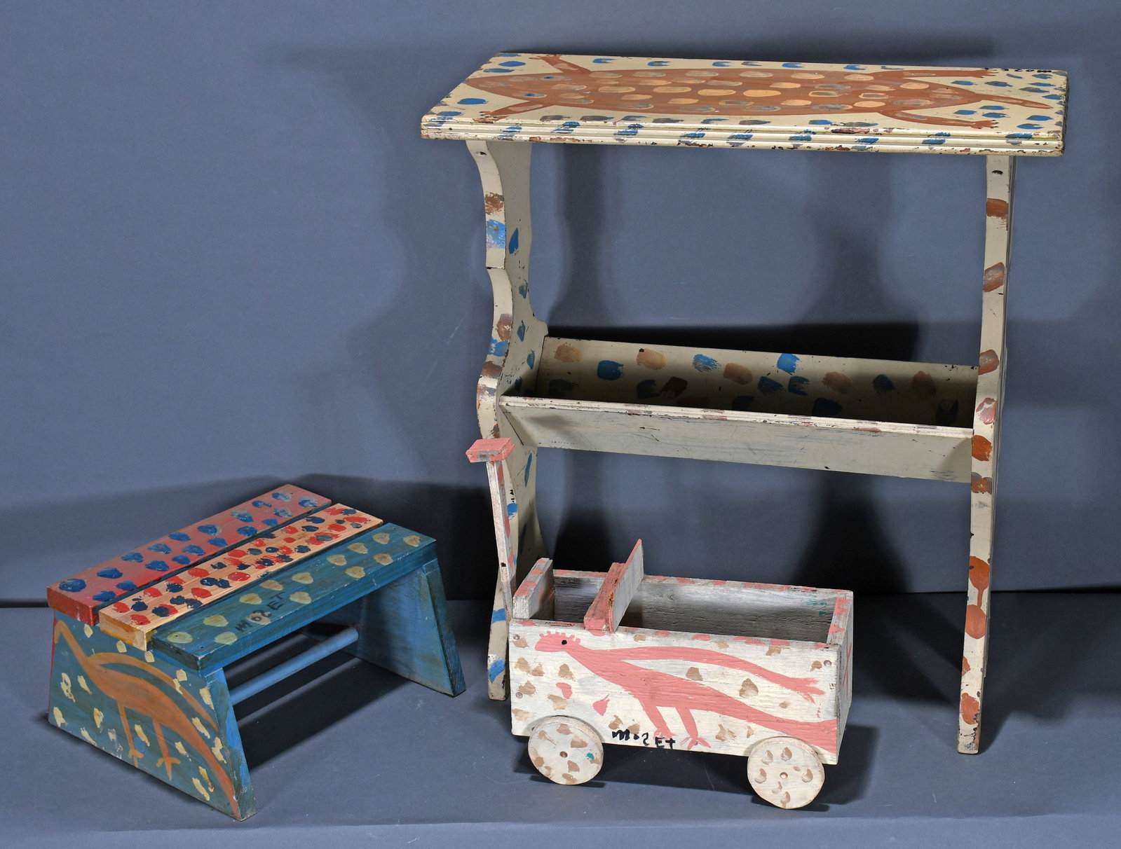 Mose Tolliver. Bookshelf Table, Cotton Wagon and Stepstool.: Mose Tolliver. Bookshelf Table, Cotton Wagon and Stepstool. All signed. Paint and wood construction. Excellent condition. Largest is 22" w x 24" h. Est. $1,000-2,000. Buyer is responsible for shipping