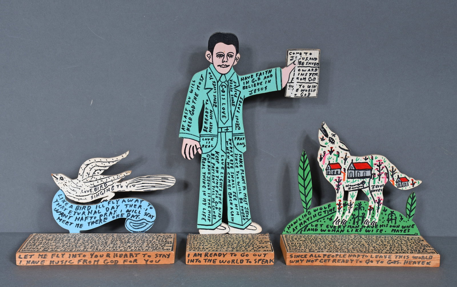 Howard Finster. Howard with Bible, Love Bird & Wolf. (1 of 2)