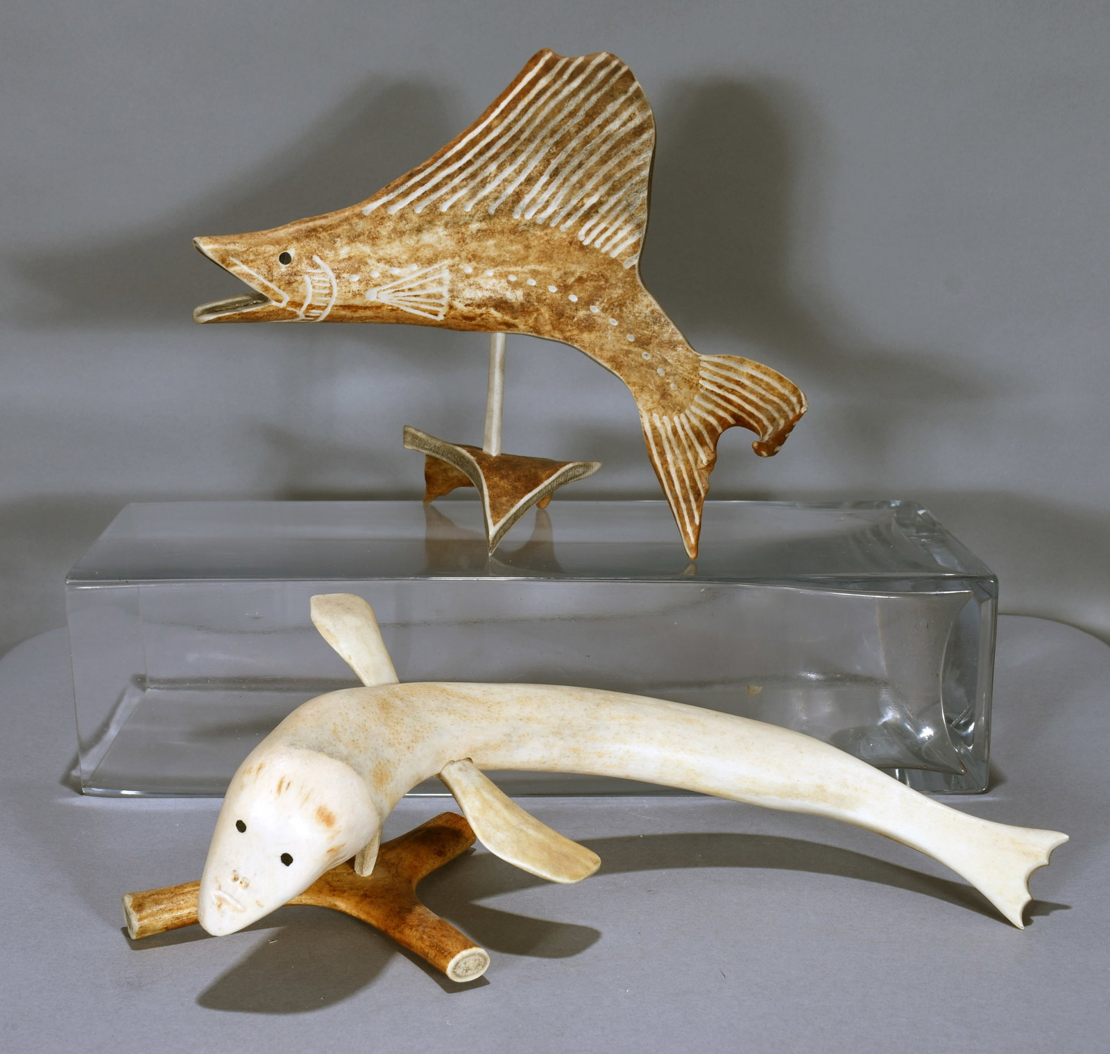 Pair of Inuit Stylized Fish.: Inuit. Pair of Stylized Fish. Not signed. c. 1980's. Carved bone. Excellent condition. Largest is 12" long. Est. $200-400. Ship: $65