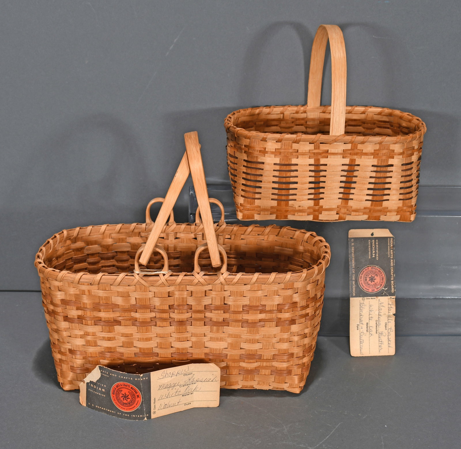 Maggie Lossiah & Maidena Panther. White Oak Handle Baskets.: Maggie Lossiah and Maidena Panther. Pair of White Oak Handle Baskets. Not signed. Comes with original Indian Arts and Craft tag. Excellent condition. Largest is 11" w x 11" h. Est. $200-300. Ship: $55