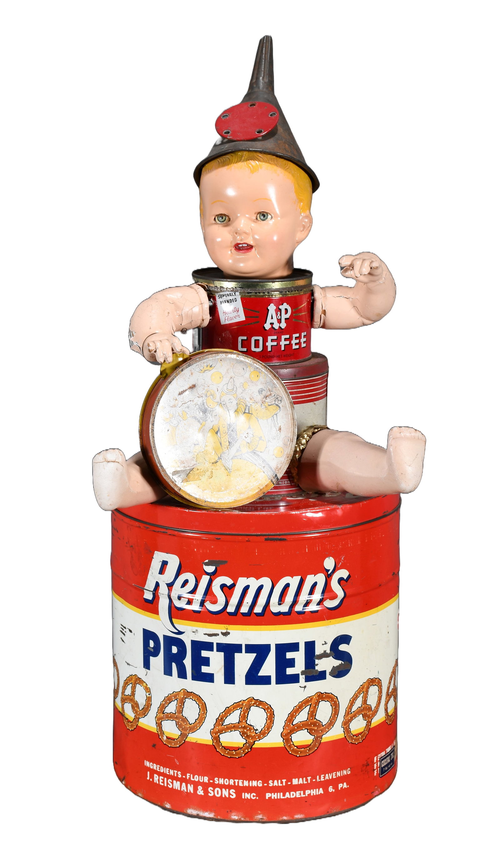 Anonymous Tin Can Baby: Anonymous. Tin Can Baby. Not signed. c. 1970's. Mixed media, baby doll and tin advertisement cans. Very good condition. 15" w x 32" h. Est. $100-200. Ship: $125