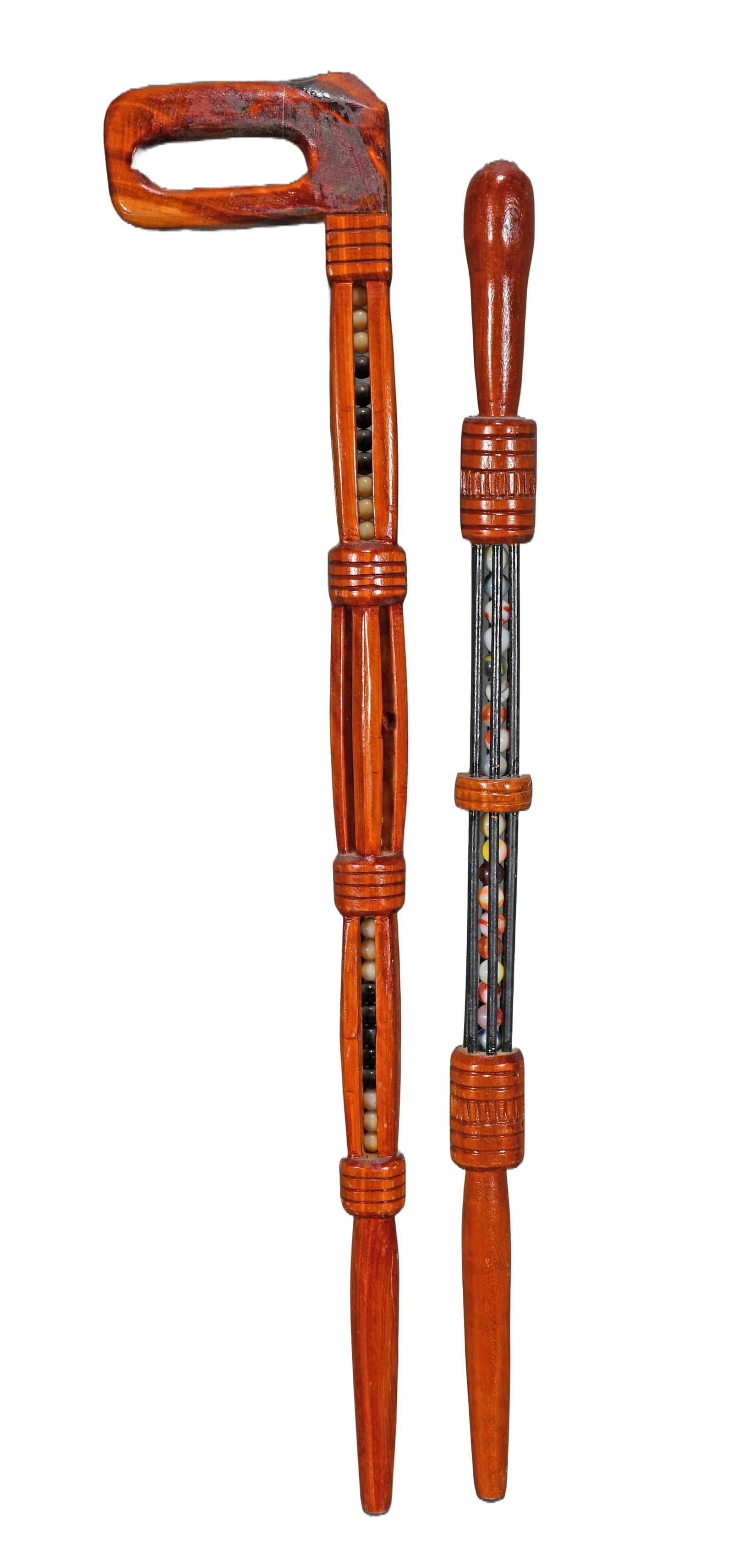 Pair of Ball and Cage Canes.: Anonymous. Pair of Ball and Cage Canes. Carved and stained wood with marbles. Excellent condition. Average size is 34" h. Est. $200-300. Ship: $55