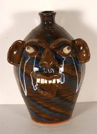 Charles Lisk. 3 Color Swirl Face Jug.: Charles Lisk. Three Color Swirl Face Jug. Not dated. Stamped with intials. Multi-colored clay with glass drip glaze. Mint condition. 12.5”h. Provenance: The Lynne Ingram Collection. Est. $200-400. S