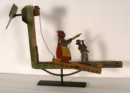 Home Sweet Home Whirligig.: Anonymous African American. Home Sweet Home Whirligig. c. 1930’s. Stereotypical subjects. Wood and tin cutouts with paint, metal gears. Great condition. 23” long x 19” x 2”. Est. $300-500. Shi