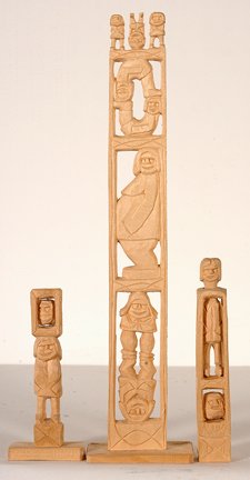 Rev. Herman Hayes. Three Totems.: Rev. Herman Hayes. Three Totems. 2004. Signed and dated. Carved natural wood. Excellent condition. Tallest is 3.5” w x 14.5”h. Provenance: The Kelly Ludwig Collection. Illustrated on page 90 Detou