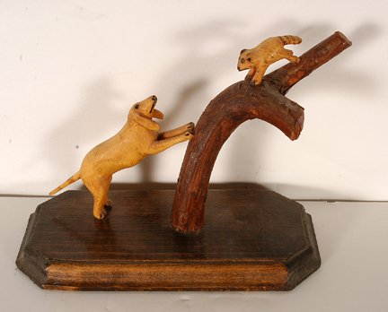 W.S. Johnson. Treeing A Coon.: W.S. Johnson. Treeing A Coon. 1983. Signed and dated. Carved and varnished wood. Excellent condition. 7” x 10” x 4”. Provenance: The Columbus Museum Columbus, GA. Est. $200-300. Ship: $35