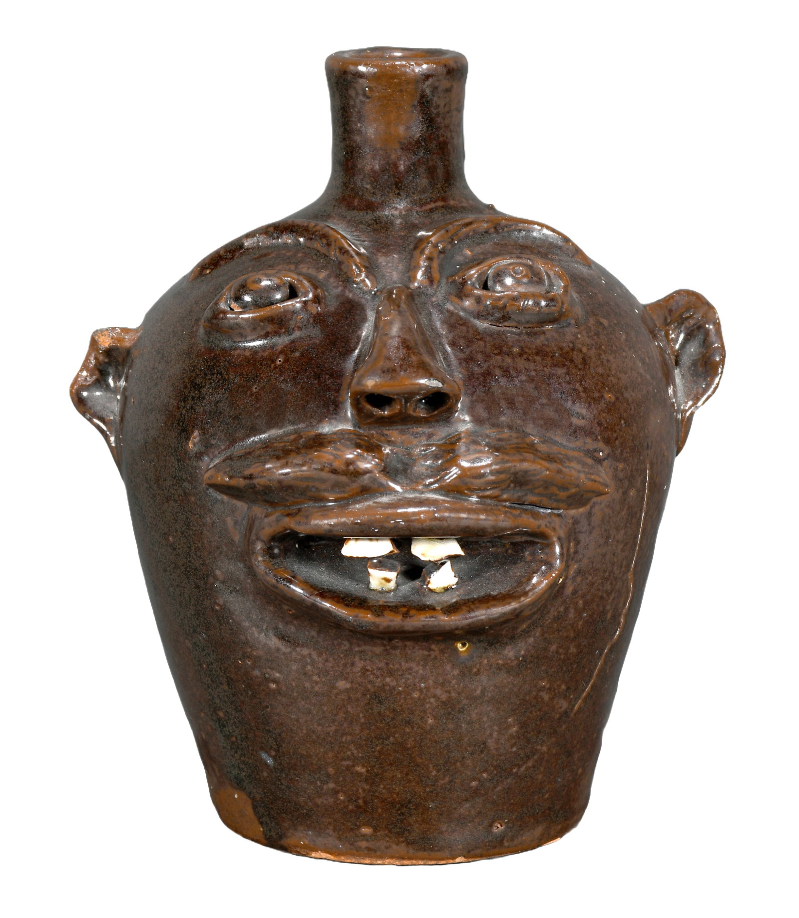 Brown's Pottery. Pint Size Face Jug with China Teeth, #47.: Brown's Pottery. Pint Size Face Jug with China Teeth, #47. Stamped and numbered in script. Minor loss of left ear, otherwise excellent condition. 6.5" h. Est. $1,000-1,500. Ship: $45