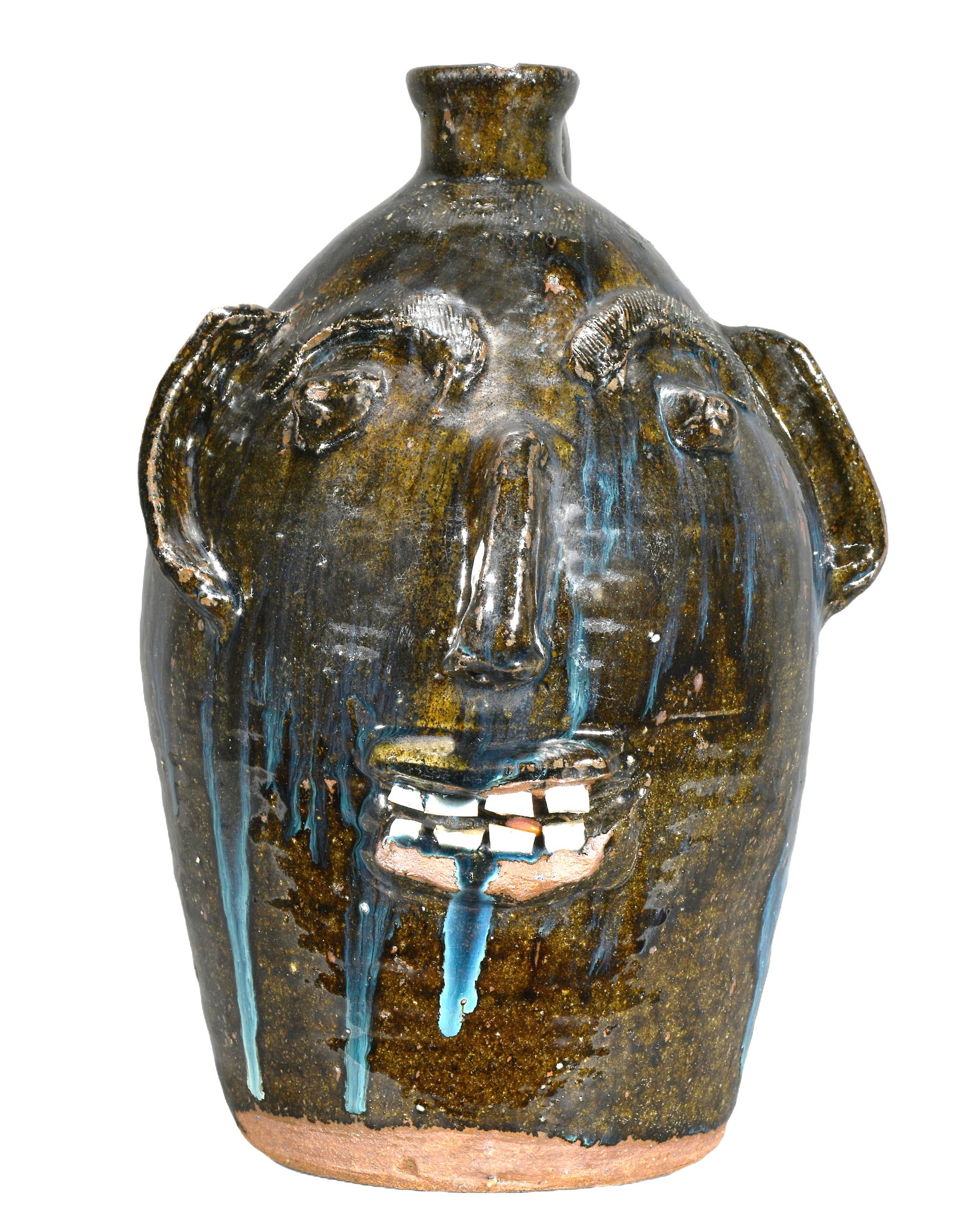 B.B. Craig.Early 3 Gallon Face Jug.: B.B. Craig. (1914-2003 - NC). Early 3 Gallon Face Jug. c. late 70's. Stamped. Dark ash glaze with blue teal drips. Double row of teeth and folky mismatched ears. Bottom lip glaze lost during firing an