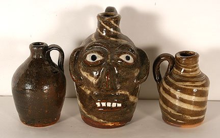B.B. Craig. Face Jug With 2 Mini Jugs.: B.B. Craig. Face Jug With 2 Mini Jugs. All stamped with name and Vale, NC. Face jug has chip in base, otherwise great condition. Tallest is 8”h. Est. $200-300. Ship: $55