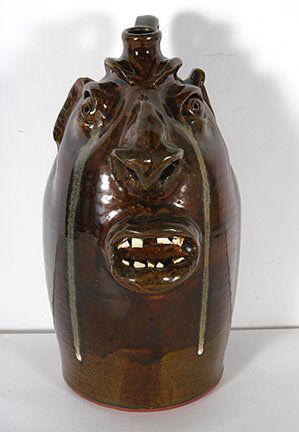 Robert Brown. Large Crying Eye Face Jug.: Robert Brown. Large Crying Eye Face Jug. Signed. Traditional glaze. Mint condition. 13.5”h. Est. $200-300. Ship: $65