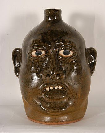 Lanier Meaders. Face Jug With Overbite.: Lanier Meaders. Face Jug With Overbite. c. 1980’s. Clay teeth. Cobalt eyes. Signed. A small amount of matt glaze on back, otherwise excellent condition. Est. $900-1,100. Ship: $45