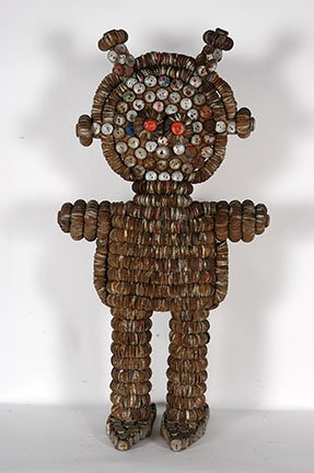 Clarence & Grace Woolsey. Female Bottlecap Fig.: Clarence and Grace Woolsey. Female Bottlecap Figure. Not signed or dated. Wire, bottlecaps nailed to wooden figure. Excellent condition. 38” h x 17” x 11”. Provenance: The Private Collection of 