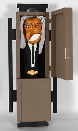 Sulton Rogers. Man In Casket.: Sulton Rogers. Man In Casket. Not signed or dated. Carved and painted wood with mixed media. Excellent condition. 24” x 9.5” x 6”. Est. $400-600. Ship: $45