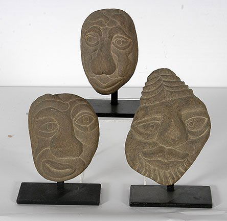 David Marshall. Three Stone Heads.: David Marshall. Three Stone Heads. Not signed or dated. Carved riverstone. Excellent condition. Average size is 6”h. Est. $200-400. Ship: $45