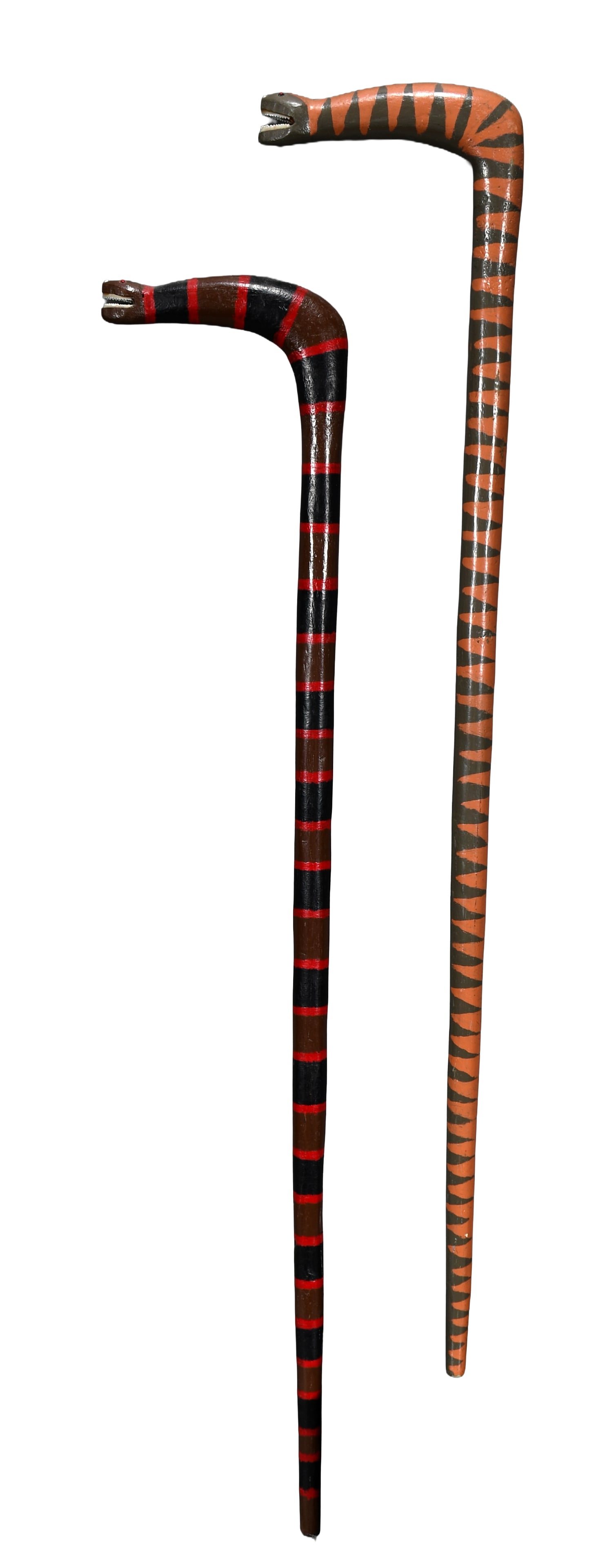 Denzil Goodpaster. Two Snake Canes.: Denzil Goodpaster. Two Snake Canes. Paint and jeweled eyes with plastic teeth on carved wood. Excellent condition. Average size is 35" h. Est. $400-600. Ship: $65