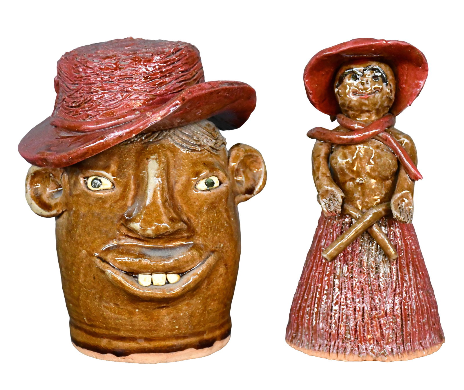 Reggie & Flossie Meaders. Face Jug & Figurine with Red Caps.: Reggie and Flossie Meaders. Face Jug and Figurine with Red Caps. Signed. Mint condition. Average is 8" h. Est. $200-400. Ship: $85 Please Read Before You Bid: By registering for and/or placing a