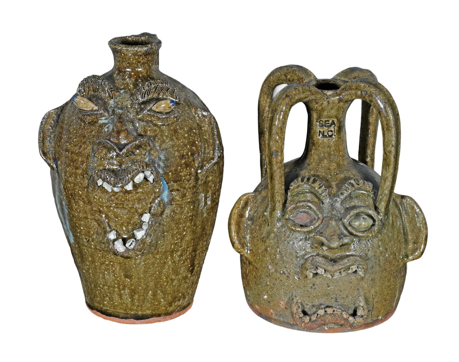 Steve Abee. Pair of Strange Face Jugs.: Steve Abee. Pair of Strange Face Jugs. Signed. One is missing an eyeball, otherwise excellent condition. Average size is 9.5" h. Est. $100-200. Ship: $85 Please Read Before You Bid: By registering for