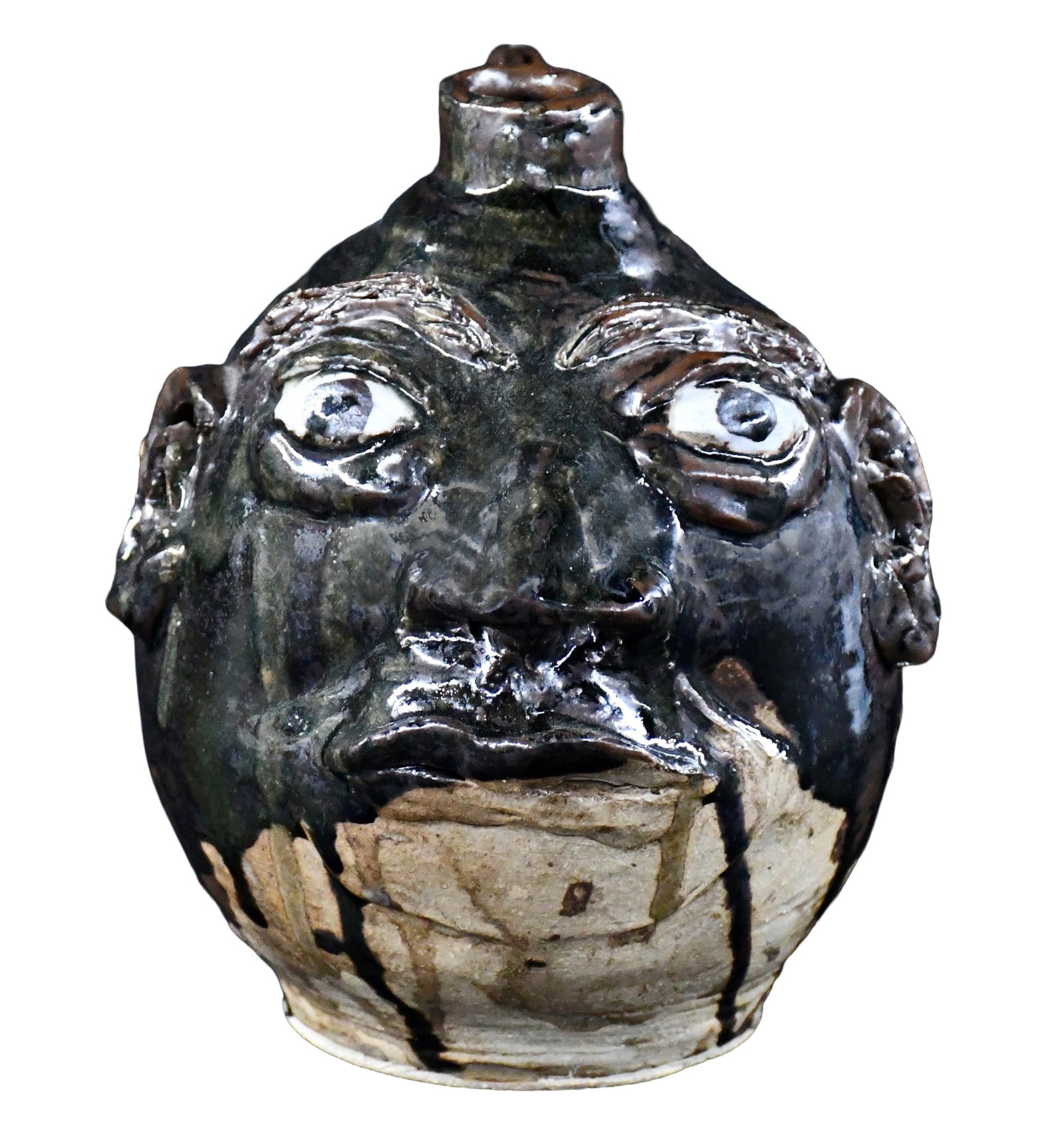 Half Gallon Face Jug.: Unknown. Half Gallon Face Jug. Two tone glazed. Mint condition. 8" h. Provenance: The Lynne Ingram Collection. Est. $100-200. Ship: $45 Please Read Before You Bid: By registering for and/or