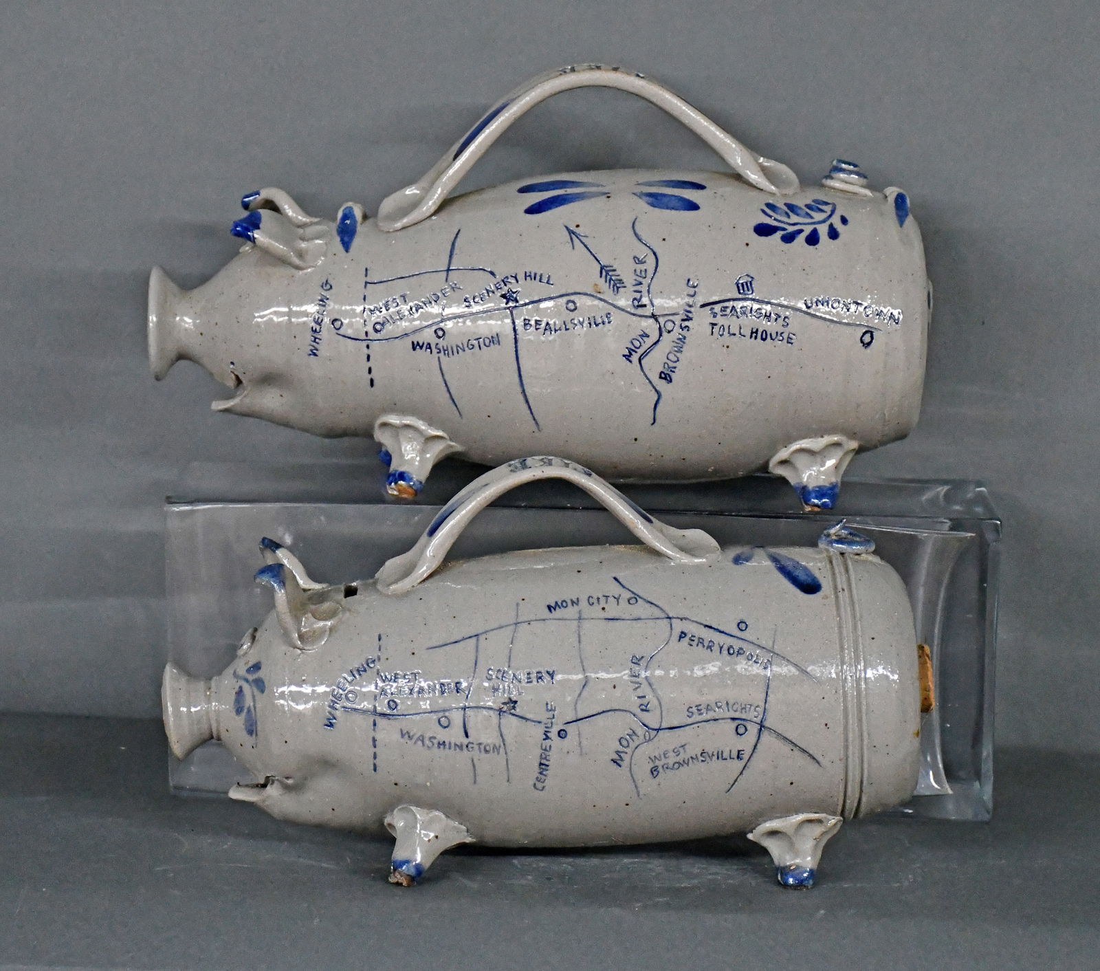 Westerwald Pottery. Pair of Pike Pig Piggybanks.: Westerwald Pottery. Pair of Pike Pig Piggybanks. 2004. Signed and dated. Salt glaze with cobalt decorated map. Mint condition. Each is 15" long. Est. $100-300. Ship: $100 Please Read Before You
