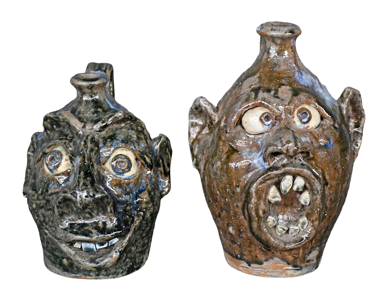 William Flowers. Pair of Face Jugs.: William Flowers. Pair of Face Jugs. 1997. Signed and dated. Mint condition. Tallest is 10.5" h. Est. $200-400. Ship: $85 Please Read Before You Bid: By registering for and/or placing a bid in any