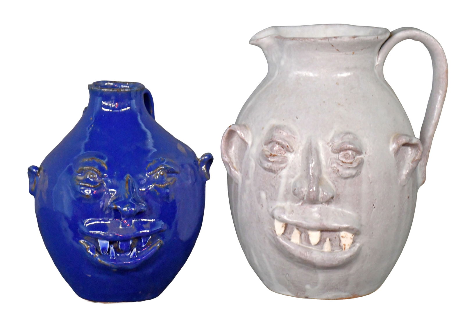 Hicks. Face Pitcher and Face Jug.: Hicks. Face Pitcher and Face Jug. Signed. Break and repair to white pitcher, otherwise good to excellent condition. Tallest is 9.5" h. Est. $100-200. Ship: $85 Please Read Before You Bid: By