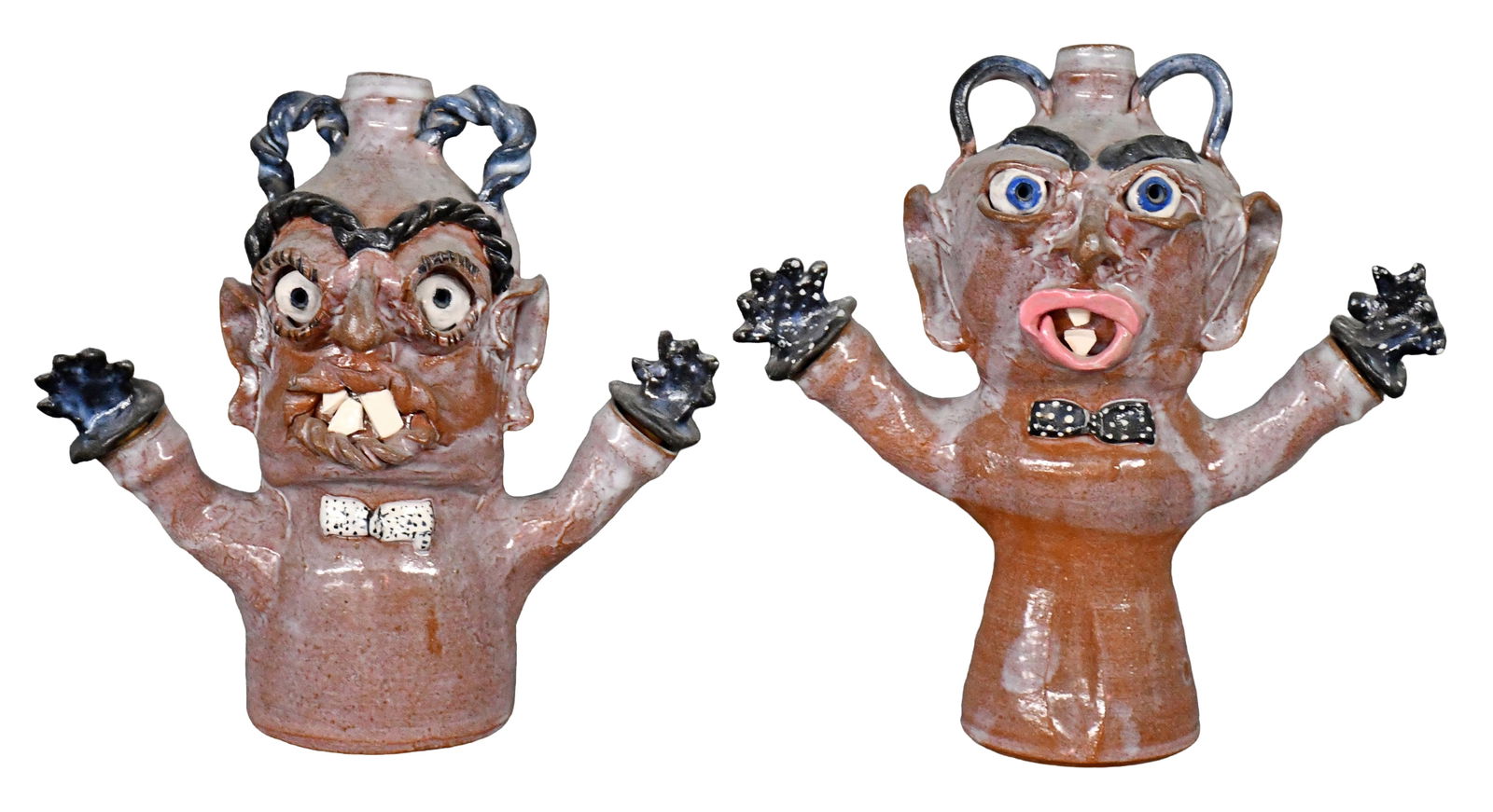 A. Teague. Pair of Figural Jugs.: A. Teague. Pair of Figural Jugs. 1992. Signed and dated. Average is 9.5" h. Est. $100-200. Ship: $85 Please Read Before You Bid: By registering for and/or placing a bid in any Slotin Auction, you