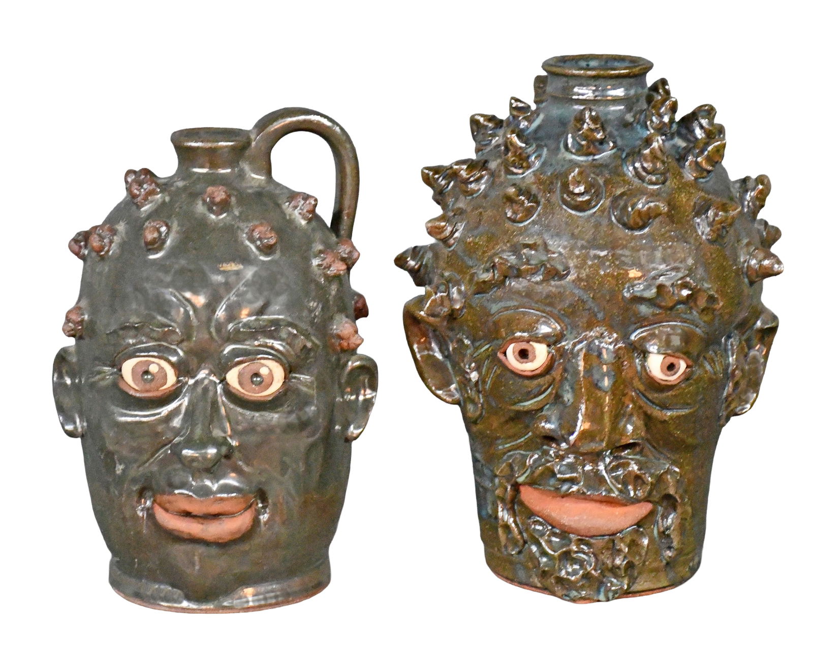 Yvette Lepley. Pair of Face Jugs with Twist Hairdos.: Yvette Lepley. Pair of Face Jugs with Twist Hairdos. Signed. Mint condition. Largest is 9" h. Est. $100-200. Ship: $85 Please Read Before You Bid: By registering for and/or placing a bid in any