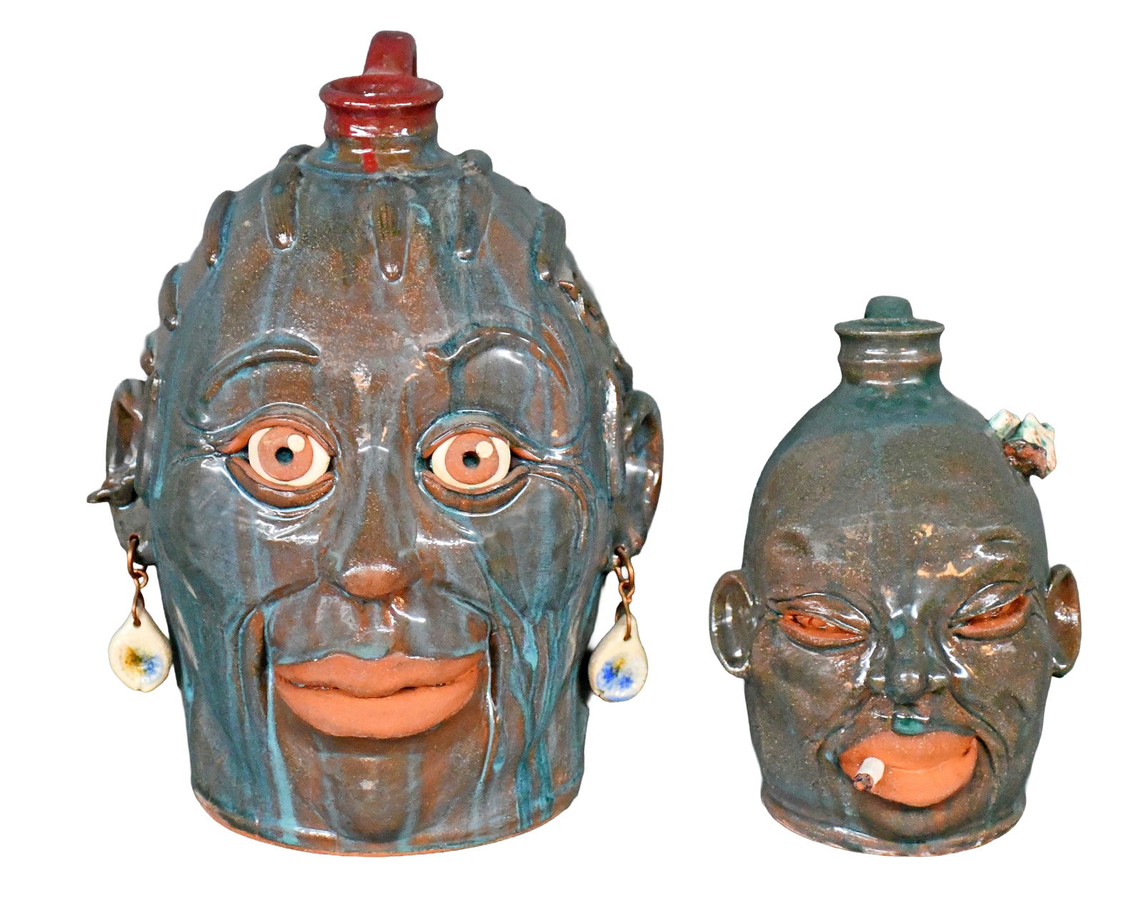 Yvette Lepley. Pair of Face Jugs.: Yvette Lepley. Pair of Face Jugs. #250, #362. Signed and numbered. Mint condition. Tallest is 10.5" h. Est. $100-200. Ship: $85 Please Read Before You Bid: By registering for and/or placing a bid