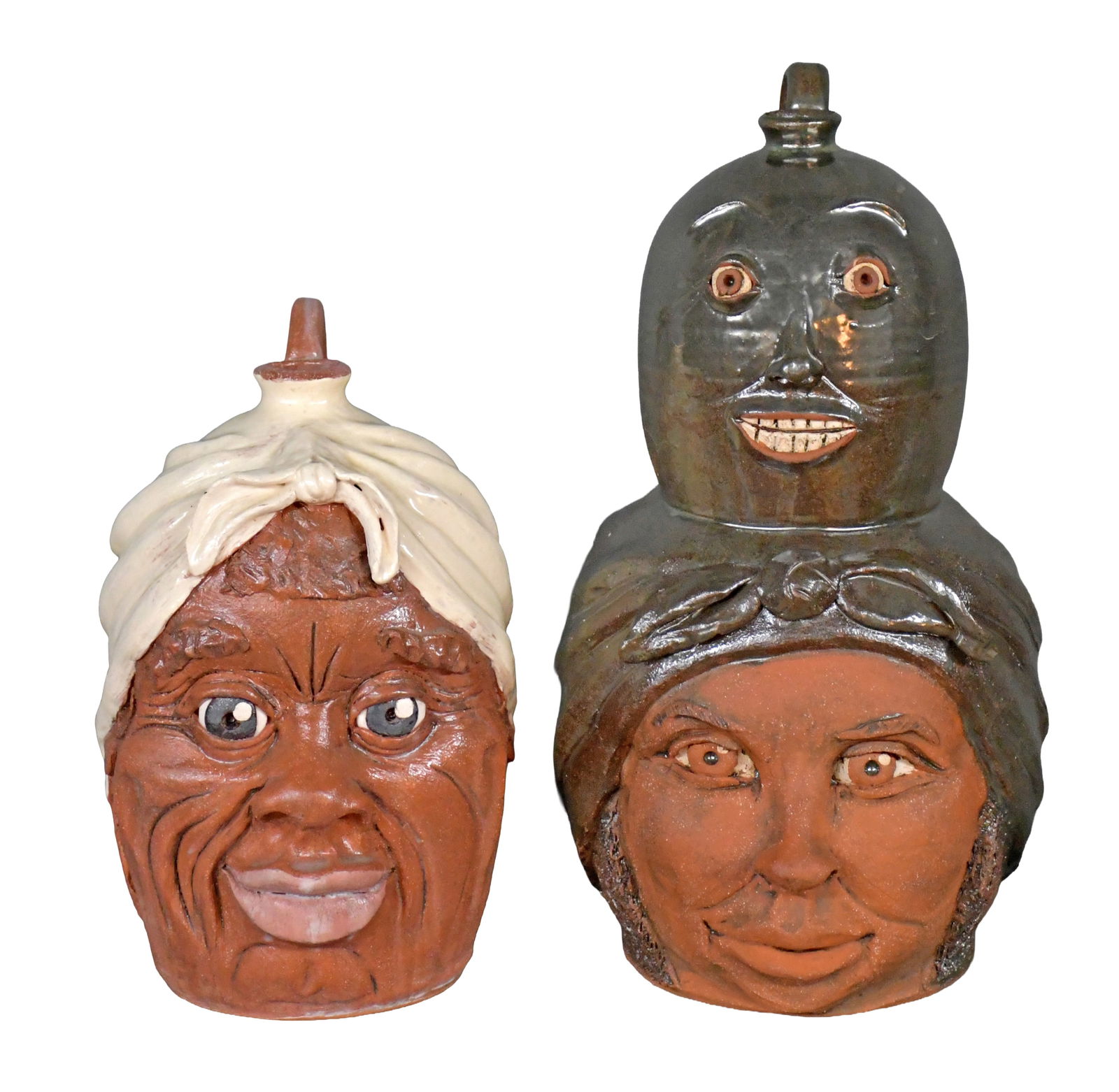 Yvette Lepley. Pair of Mammy Jugs.: Yvette Lepley. Pair of Mammy Jugs. #319, #260. Signed and numbered. Mint condition. Largest is 12" h. Est. $100-200. Ship: $100 Please Read Before You Bid: By registering for and/or placing a bid