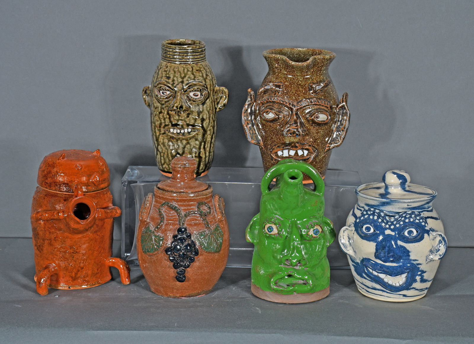 6 Strange Face Jugs and Pottery Wares.: Group of Six Strange Face Jugs and Pottery Wares. Signed. Mint condition. Average size is 8" h. Est. $100-300. Ship: $150 Please Read Before You Bid: By registering for and/or placing a bid in any
