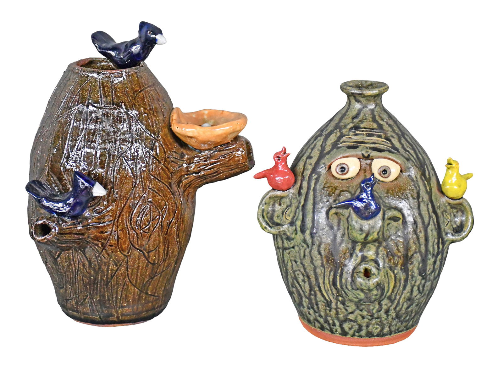 Mike Hanning and Brian Wilson.. Pair of Jugs with Birds.: Mike Hanning and Brian Wilson. Pair of Jugs with Birds. Signed. Mint condition. Tallest is 9.5" h. Est. $100-200. Ship: $100 Please Read Before You Bid: By registering for and/or placing a bid in