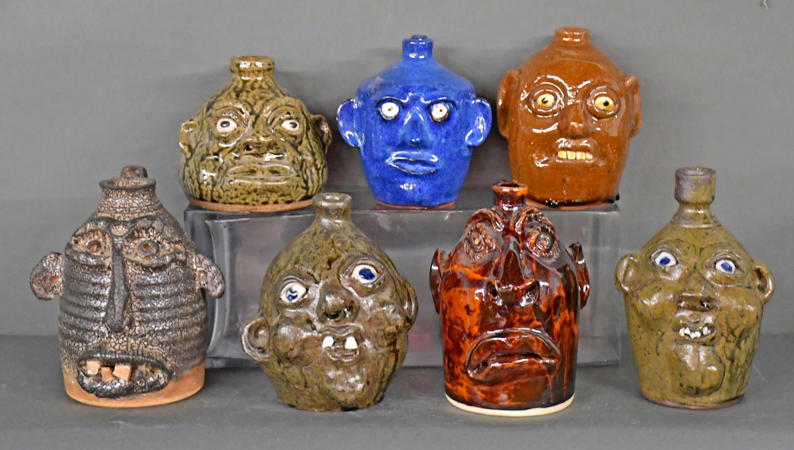 Hewell, Meaders, Brown. 7 Pint-Size Face Jugs. (1 of 2)