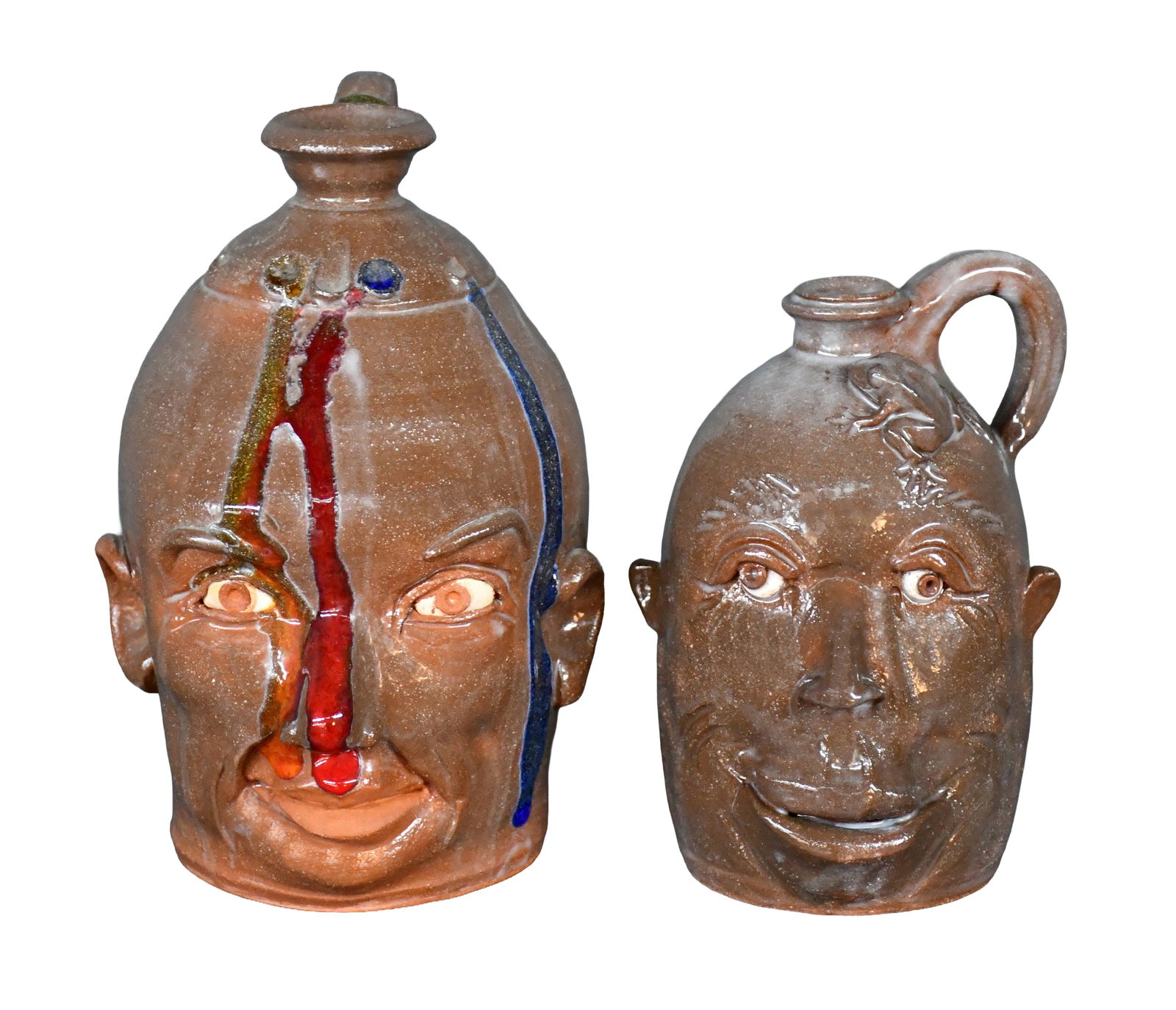 Yvette Lepley. Pair of Face Jugs.: Yvette Lepley. Pair of Face Jugs. #233, #275. Signed and numbered. Mint condition. Tallest is 8.5" h. Est. $100-200. Ship: $75 Please Read Before You Bid: By registering for and/or placing a bid