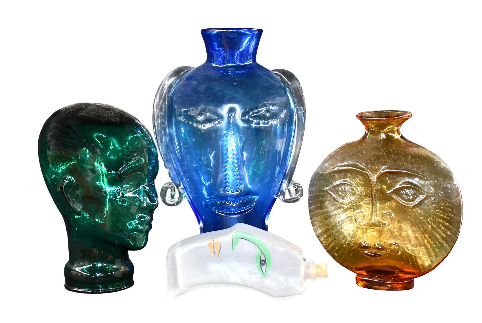 Four Decorated Glass Faces.: Unknown. Four Decorated Glass Faces. Painted colored glass. Excellent condition. Tallest is 16" h. Est. $25-50. Ship: $150 Please Read Before You Bid: By registering for and/or placing a bid in