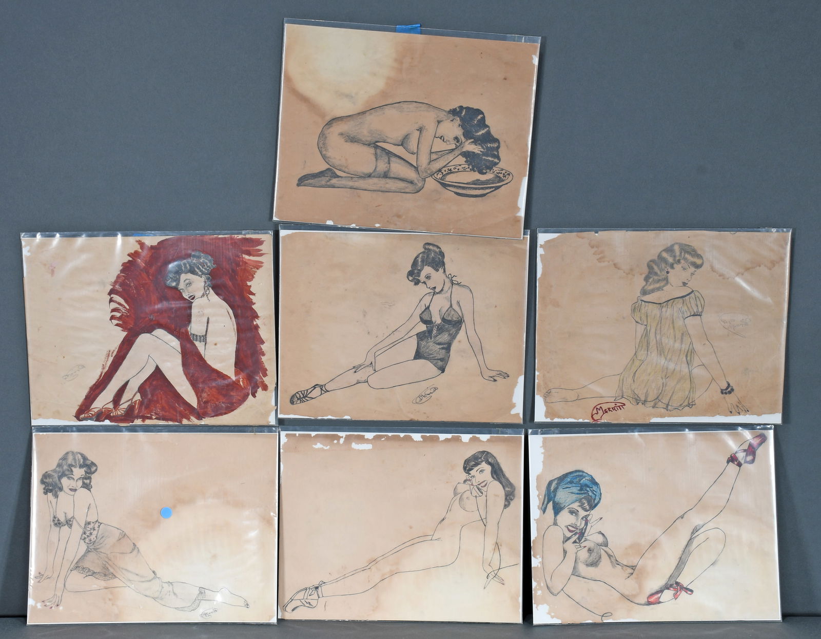 Merritt. Group of 7 Female Erotic Sketches.: Merritt. Group of 7 Female Erotic Sketches. c. 1930's. Signed. Ink and mixed media on paper. Toning, staining and loss otherwise good to fair condition. Each is 11" w x 9" h. Est. $100-200. Ship: $45