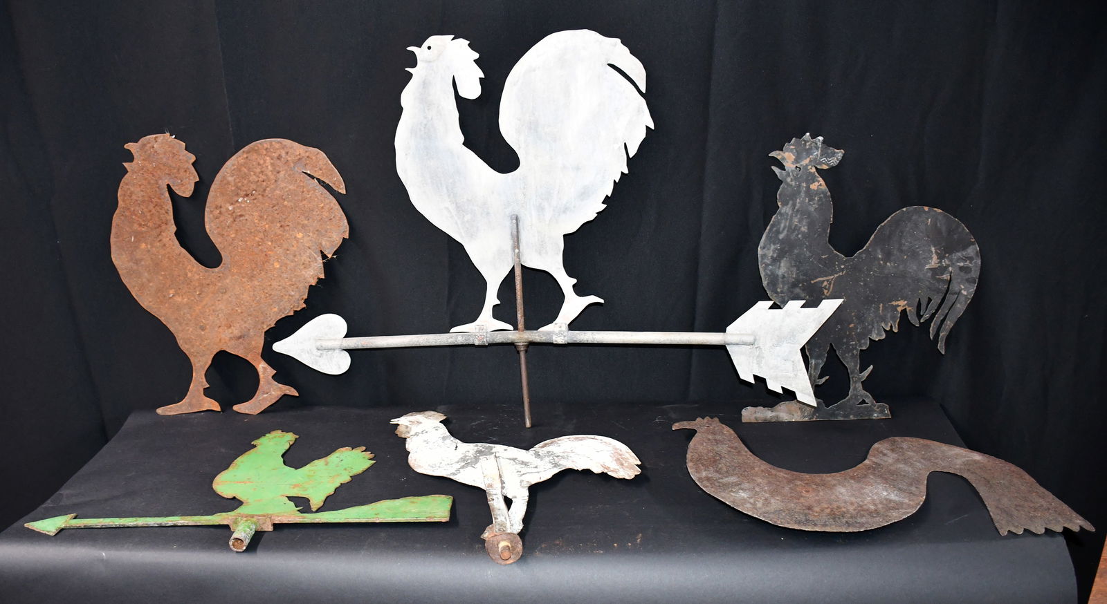 Six Chicken Weathervanes.: Anonymous. Group of Six Chicken Weathervanes. Not signed. Cut out metal and tin with some paint. Expected weathering and wear, otherwise good to fair condition. Largest is 36" w x 24" h. Est.