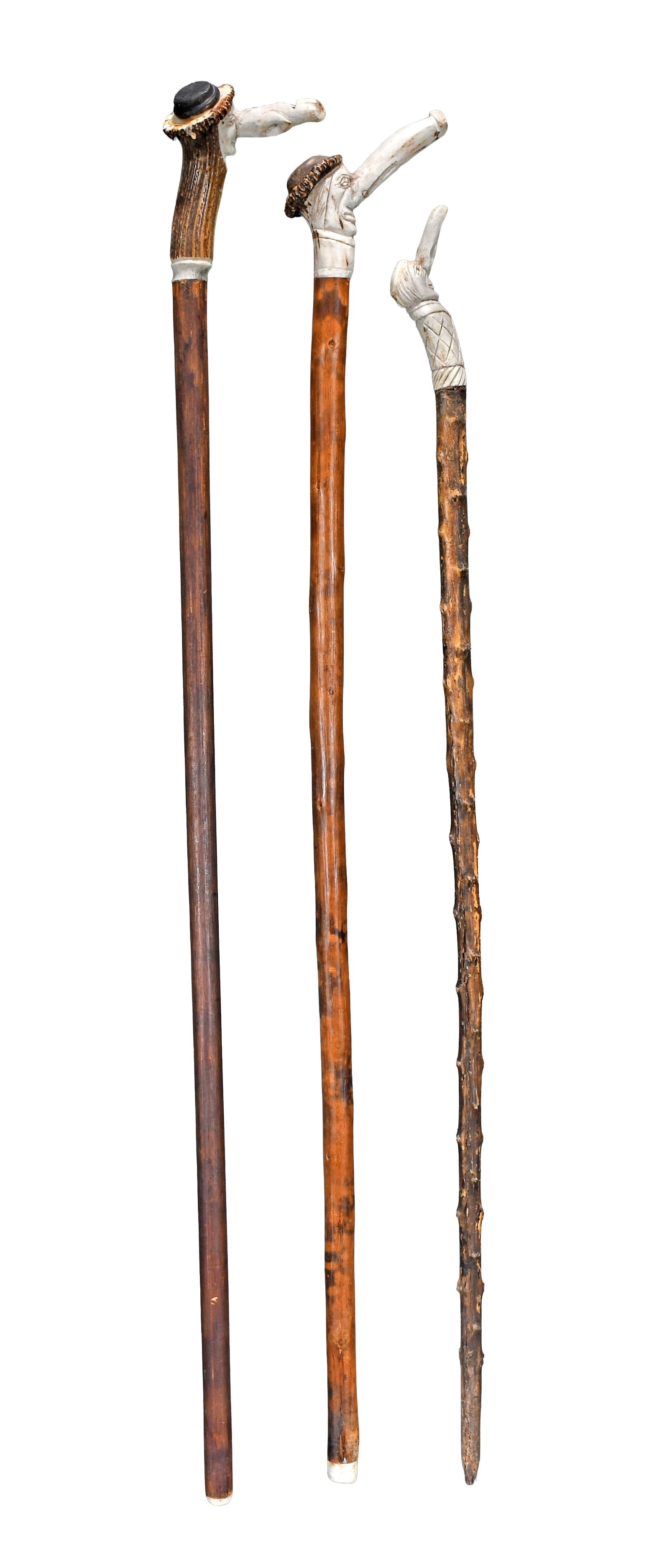 A3 Long Nose Carved Bone Top Canes.: Anonymous. 3 Long Nose Carved Bone Top Canes. Carved bone whistle and pipe topped canes of carved and stained wood. Minor wear, otherwise good condition. Average size is 36" h. Est. $200-300. Ship: $6