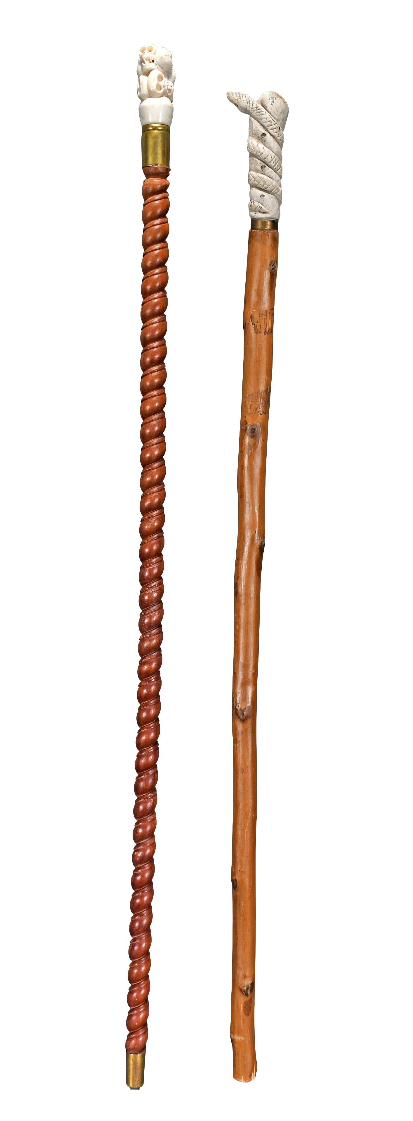 Bone Top Coiled Snake and Multi Skull Canes.: Anonymous. Bone Top Coiled Snake and Multi Skull Canes. Carved and stained wood with bone carved top. Great condition. Average size is 36" h. Est. $200-300. Ship: $65 Please Read Before You Bid: By re