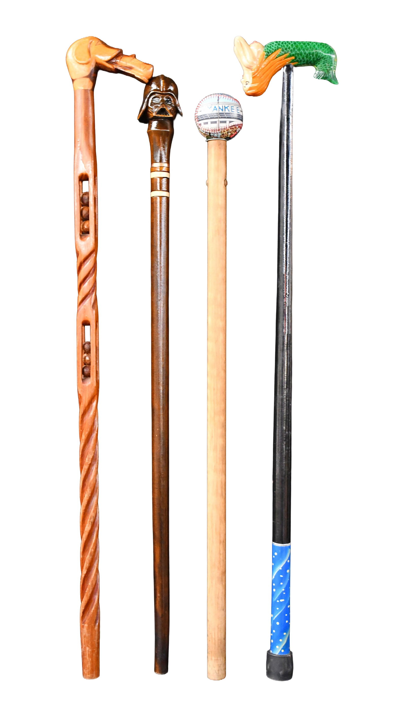 Group of Four Contemporary Canes.: Anonymous. Group of Four Contemporary Canes. Not signed. Carved and painted wood with mixed media. Great condition. Average is 36" h. Est. $200-300. Ship: $65 Please Read Before You Bid: By