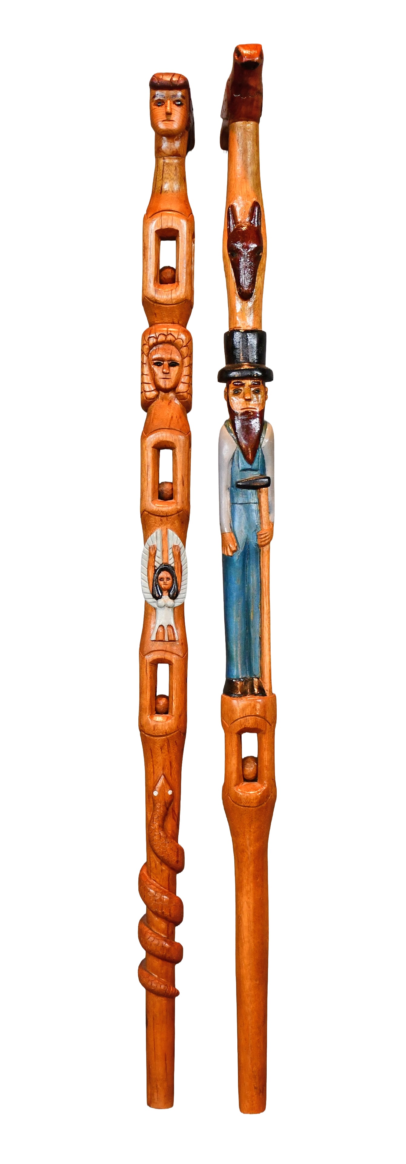 G.E. Pair of Highly Decorated Canes.: G.E. Pair of Highly Decorated Canes. 1993. Initialed and dated. Carved and painted wood with jeweled eyes. Excellent condition. Average is 39" h. Est. $200-300. Ship $65 Please Read Before You Bid: