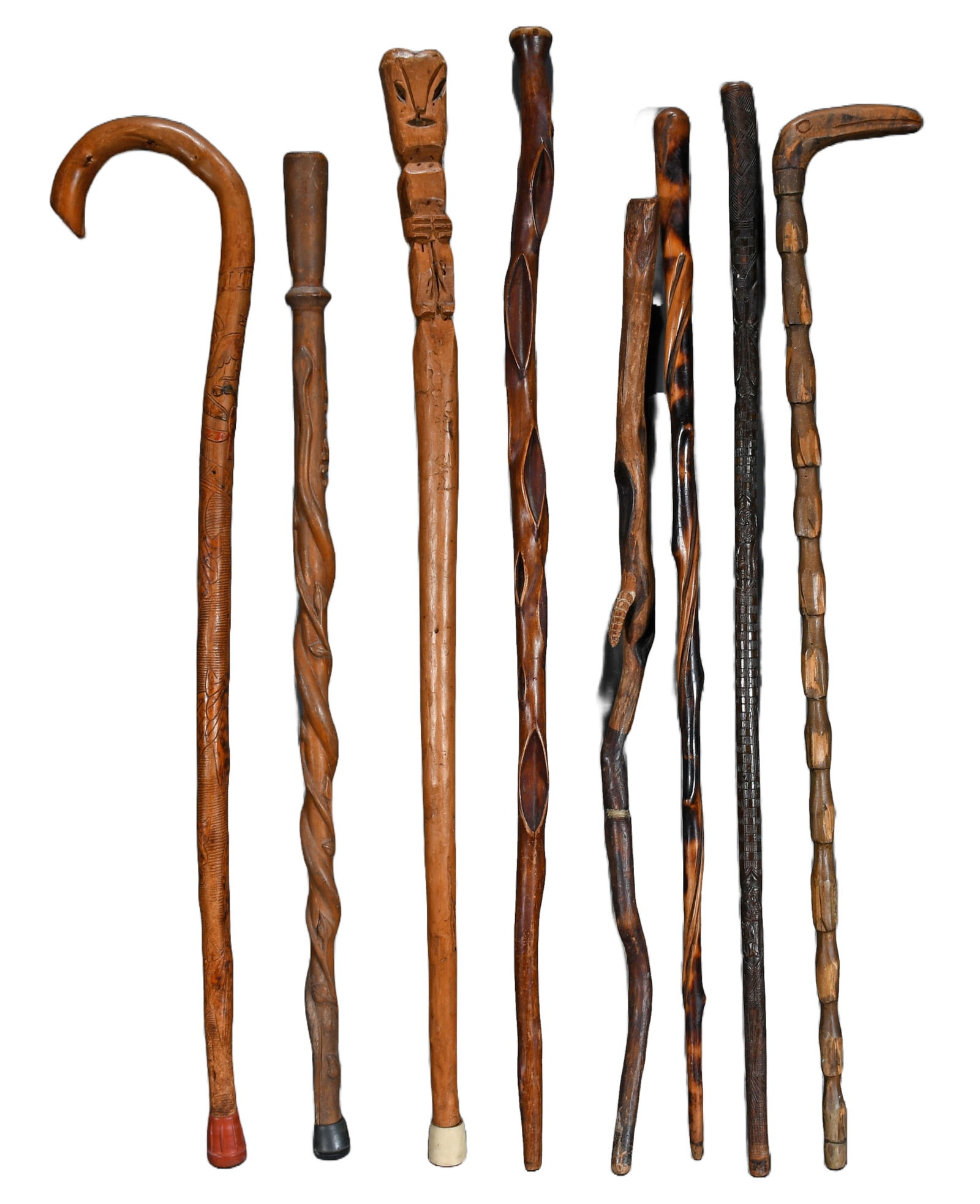 Eight Anonymous Canes.: Anonymous Group of Eight Canes. Carved and stained wood. All in good to great condition. Tallest is 35.5" h. Est. $100-200. Ship: $85 Please Read Before You Bid: By registering for and/or placing